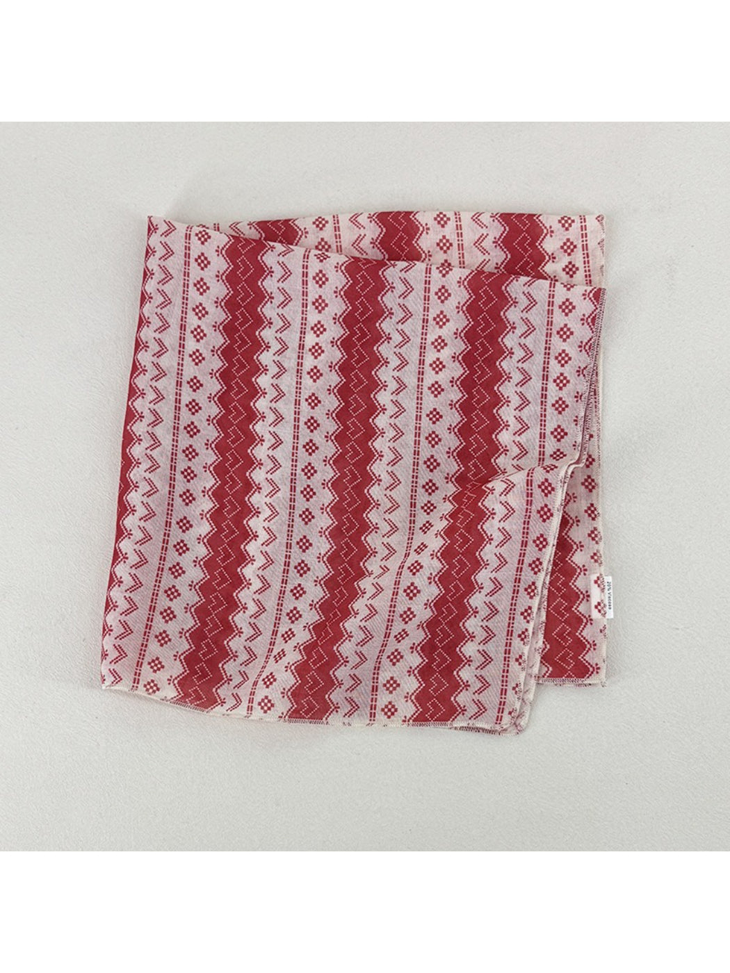 Scarvii scarf styled as headwrap highlighting geometric design and color contrast