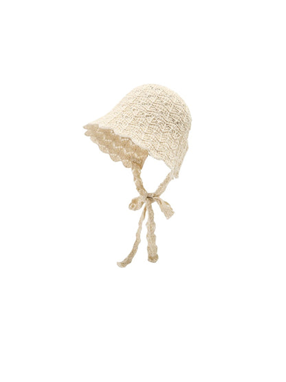 Close-up of Haila Tie Strap Knit Bucket Hat highlighting knit pattern and strap detail