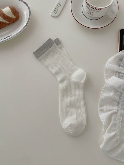 Side view of Rufia ribbed socks highlighting soft tone contrast pattern