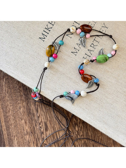 Beco braided boho chain belt laid flat showing full length