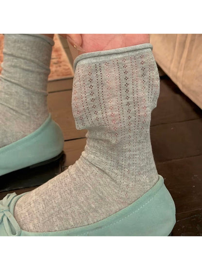 Close-up of Rufia ribbed mid-calf socks showing texture and ribbing
