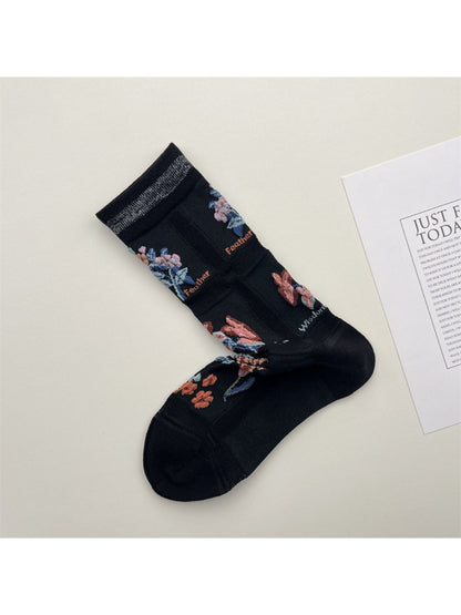 Close-up of Rufia mesh floral mid-calf socks highlighting mesh texture and floral design