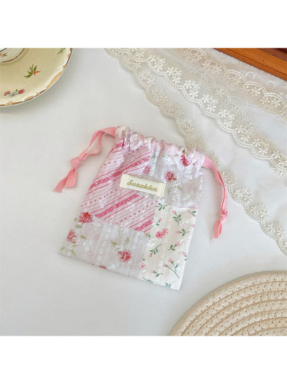 Side view of Cosbai drawstring pouch showing patchwork details and fabric texture