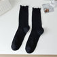 Rufia soft ribbed crew socks with delicate ruffle trim on ankle
