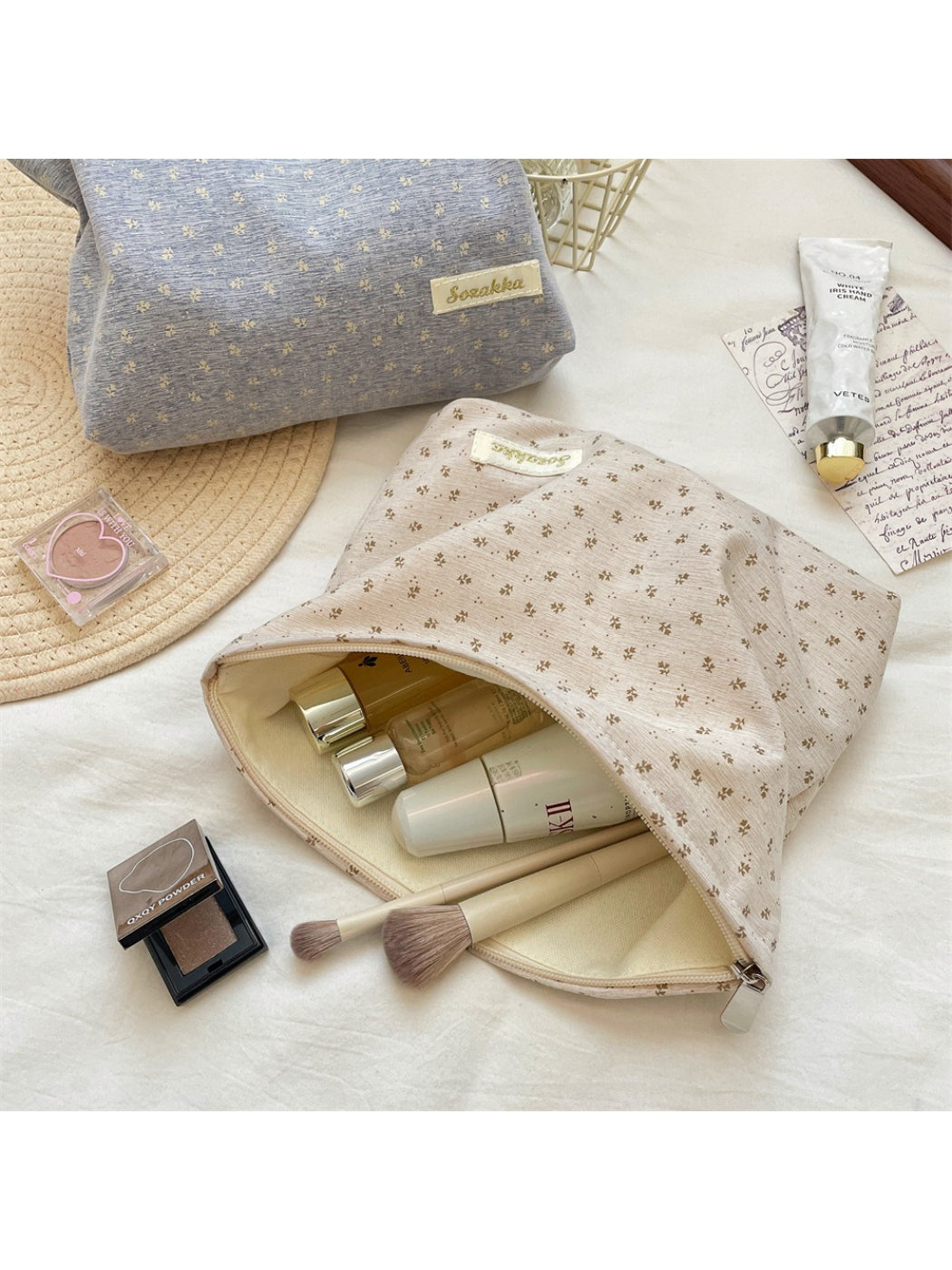 Cosbai vintage tiny flower cosmetic pouch partially open on a wooden surface
