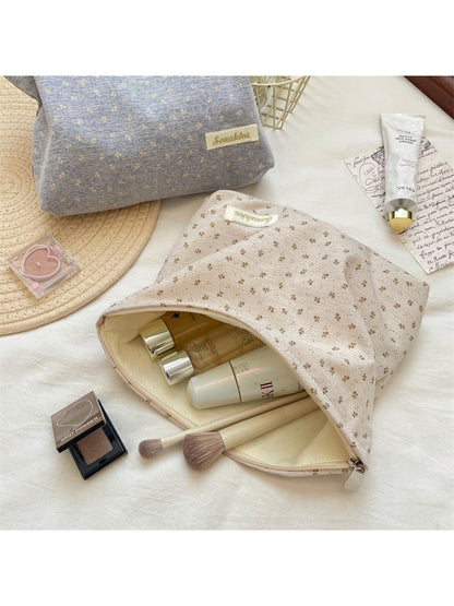 Cosbai vintage tiny flower cosmetic pouch partially open on a wooden surface