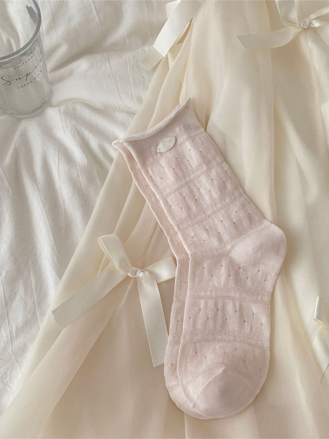 Rufia mesh dot mid-calf socks laid out to show full length and dot design