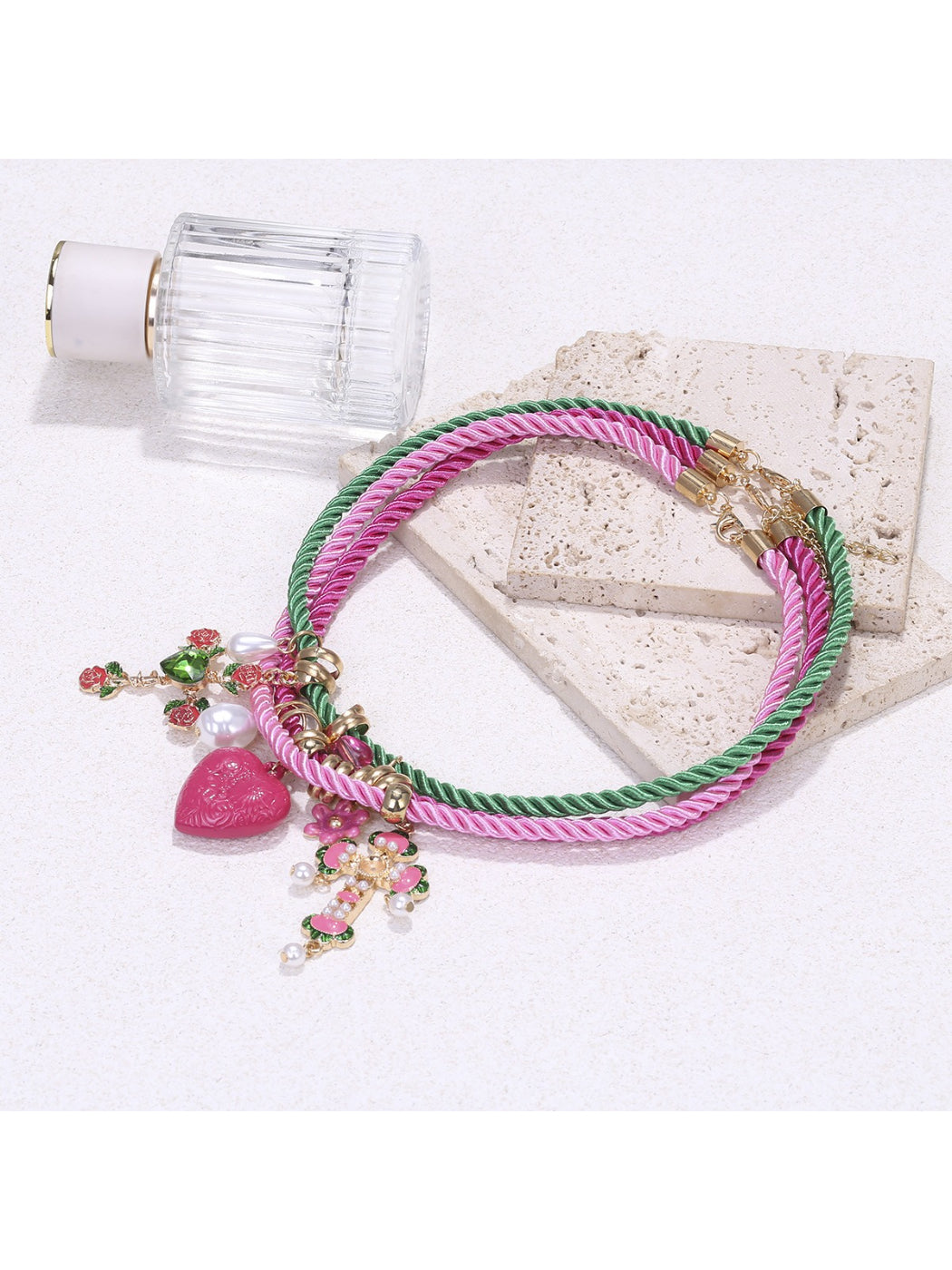 Neckit color rope charm necklace with heart detail worn on neck