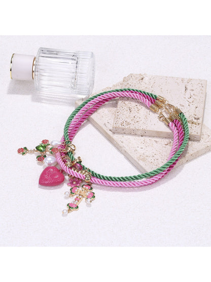 Neckit color rope charm necklace with heart detail worn on neck