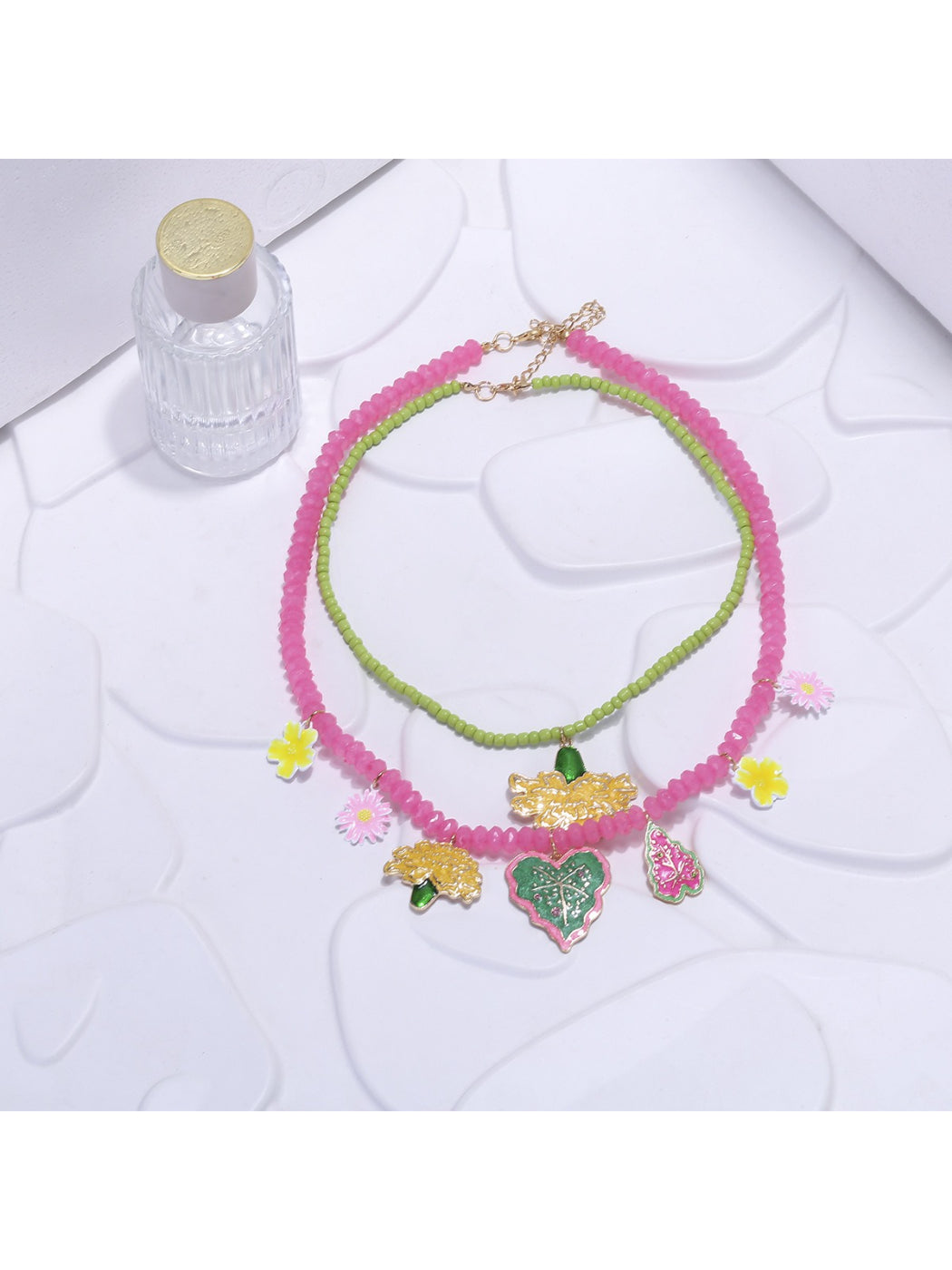 Close-up of Neckit Summer Fruit Necklace featuring colorful fruit and floral charm details