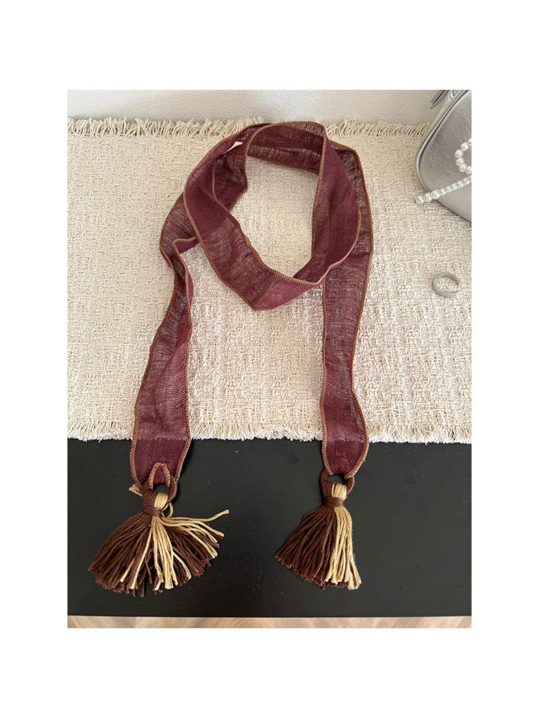 Scarvii skinny scarf showing boho pattern and tassel trim close-up