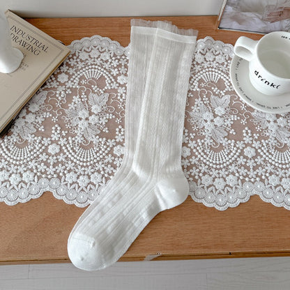 Rufia soft stretch ribbed crew socks displayed with packaging and branding
