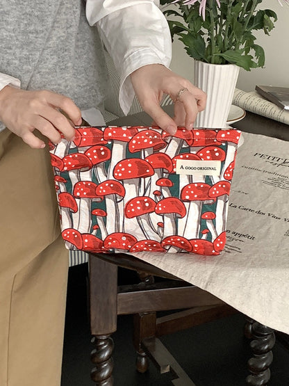 Side view of Cosbai cosmetic bag with forest mushroom print and fabric texture