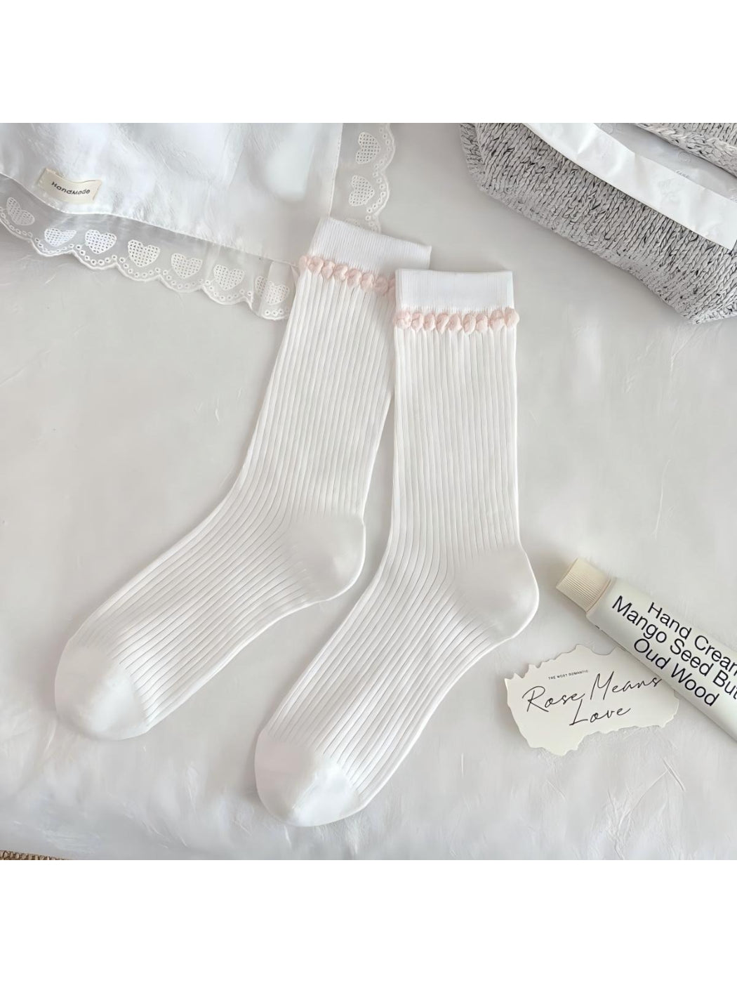 Side view of Rufia Romantic Lace Cuff Crew Socks highlighting lace cuff and knit texture