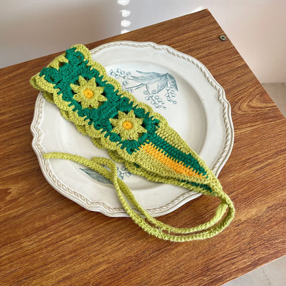 Close-up of crochet flower hairband flowers with intricate yarn patterns