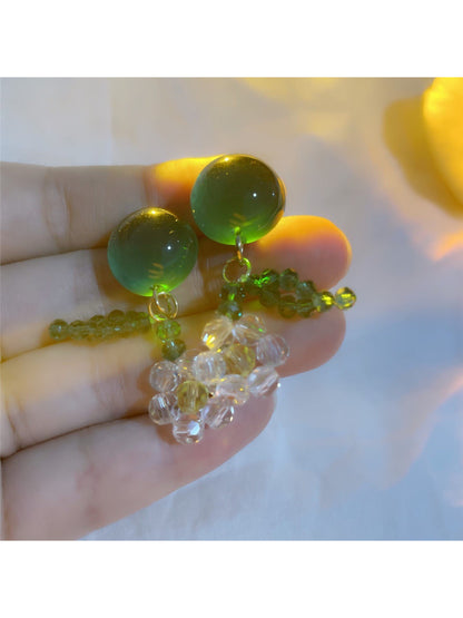Side view of Earwish beaded floral earrings highlighting the dangle style and colors
