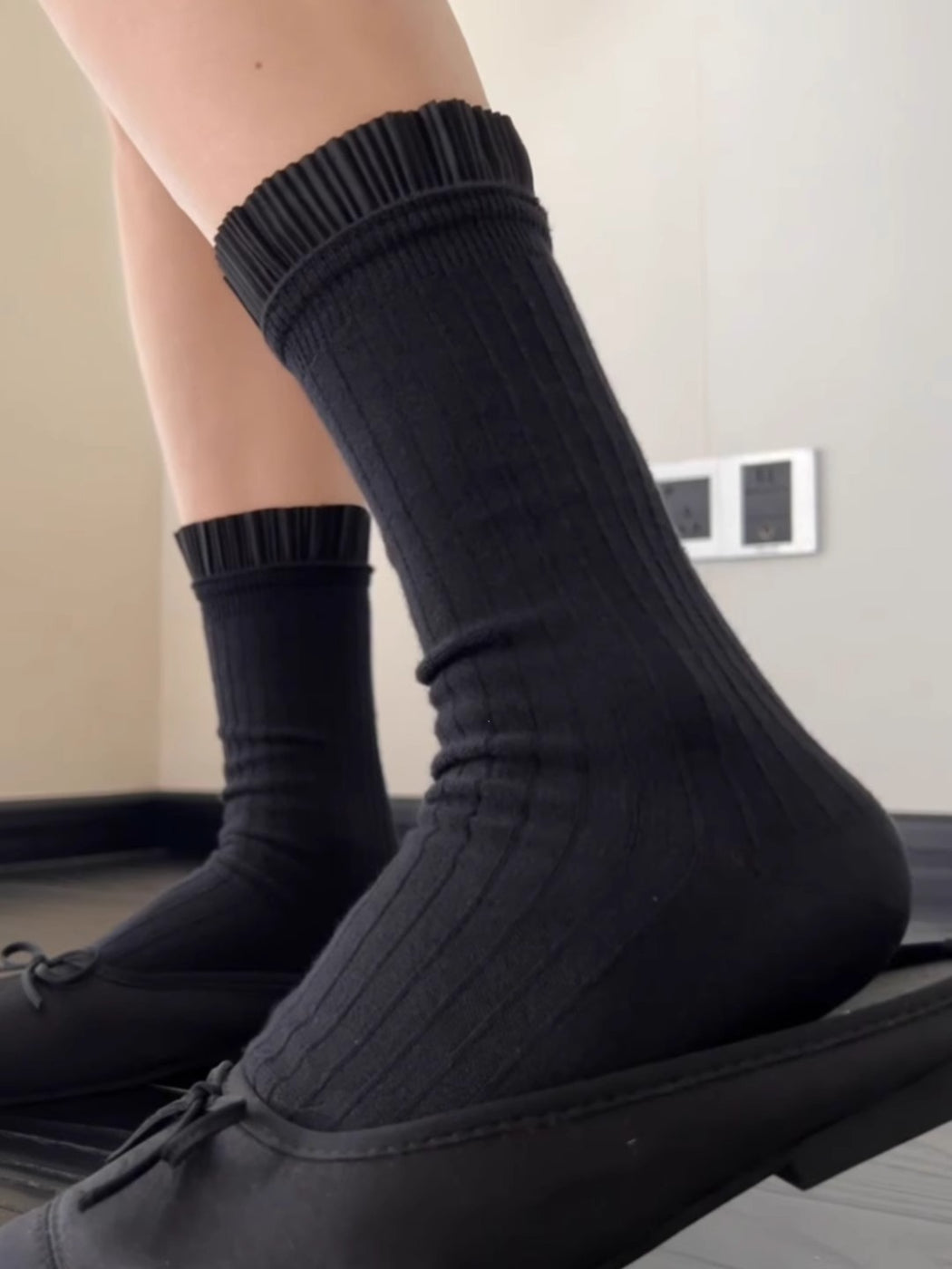Side view of Rufia Pleated Cuff Crew Socks worn by model