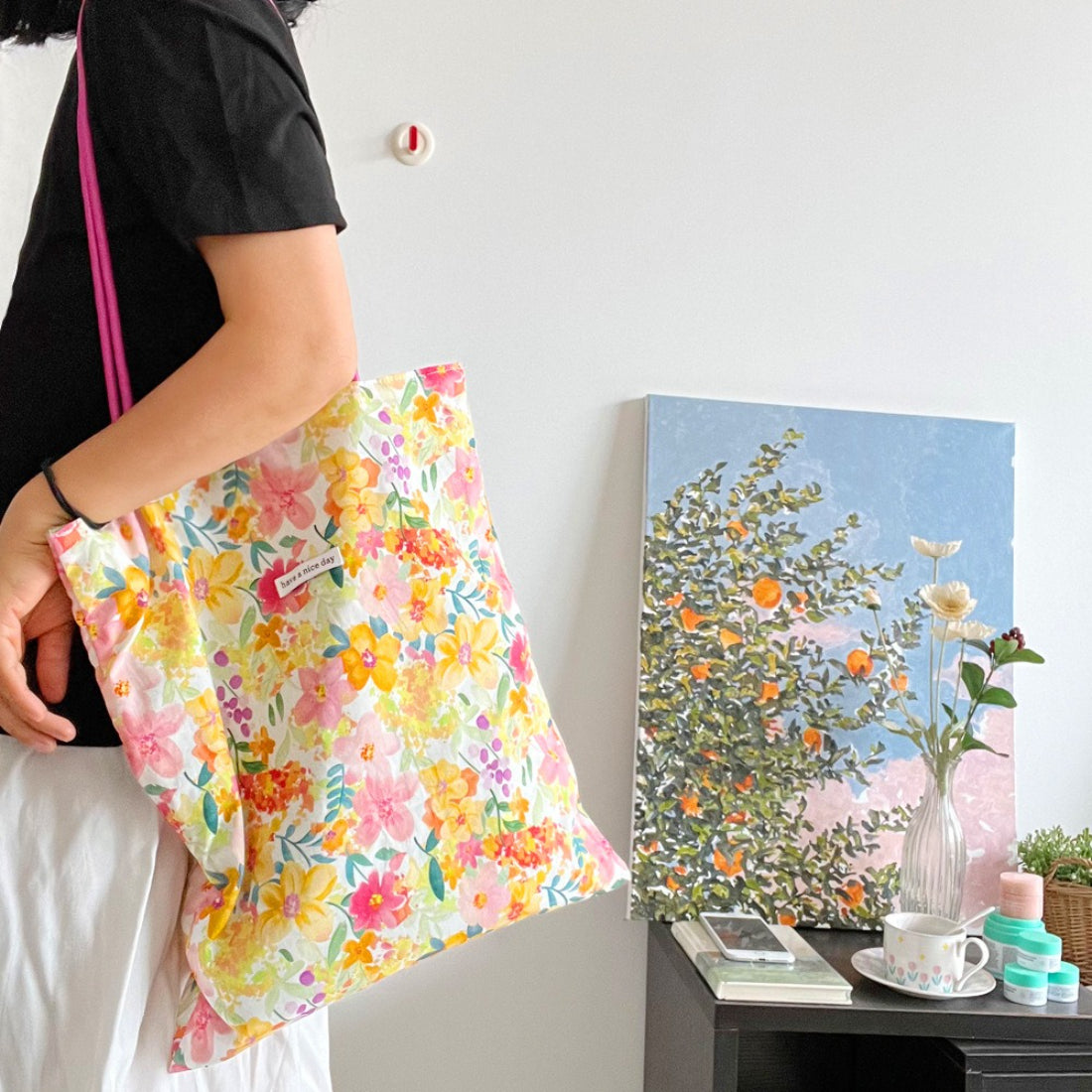 Side view of Cosbai pink strap floral tote bag highlighting strap design