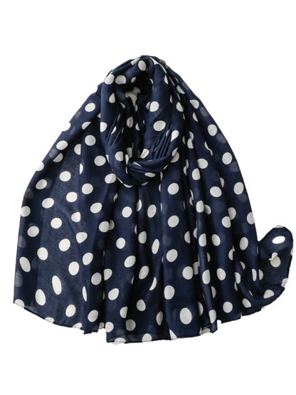Scarvii scarf draped over shoulders highlighting lightweight material and polka dot pattern