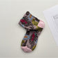 Rufia embossed floral mid-calf socks