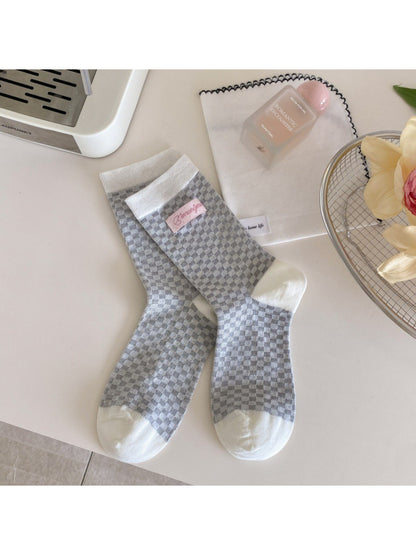 Flat lay of Rufia socks displaying the full design and color