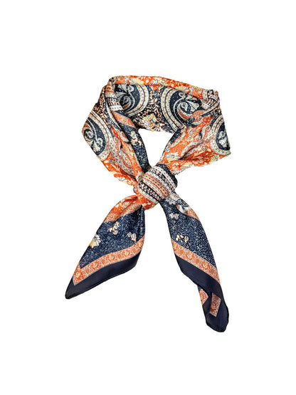 Model wearing Scarvii Ornate Scroll Square Scarf styled around the neck with elegant drape