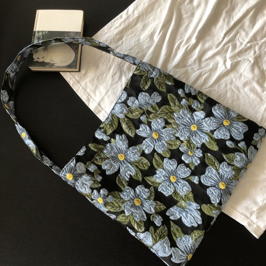 Cosbai Daisy Garden tote bag with adjustable tan shoulder strap and floral design