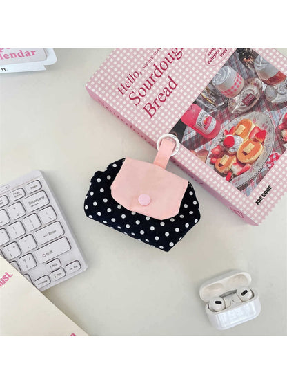 Cosbai mini polka dot pouch bag placed on a white surface with shadow