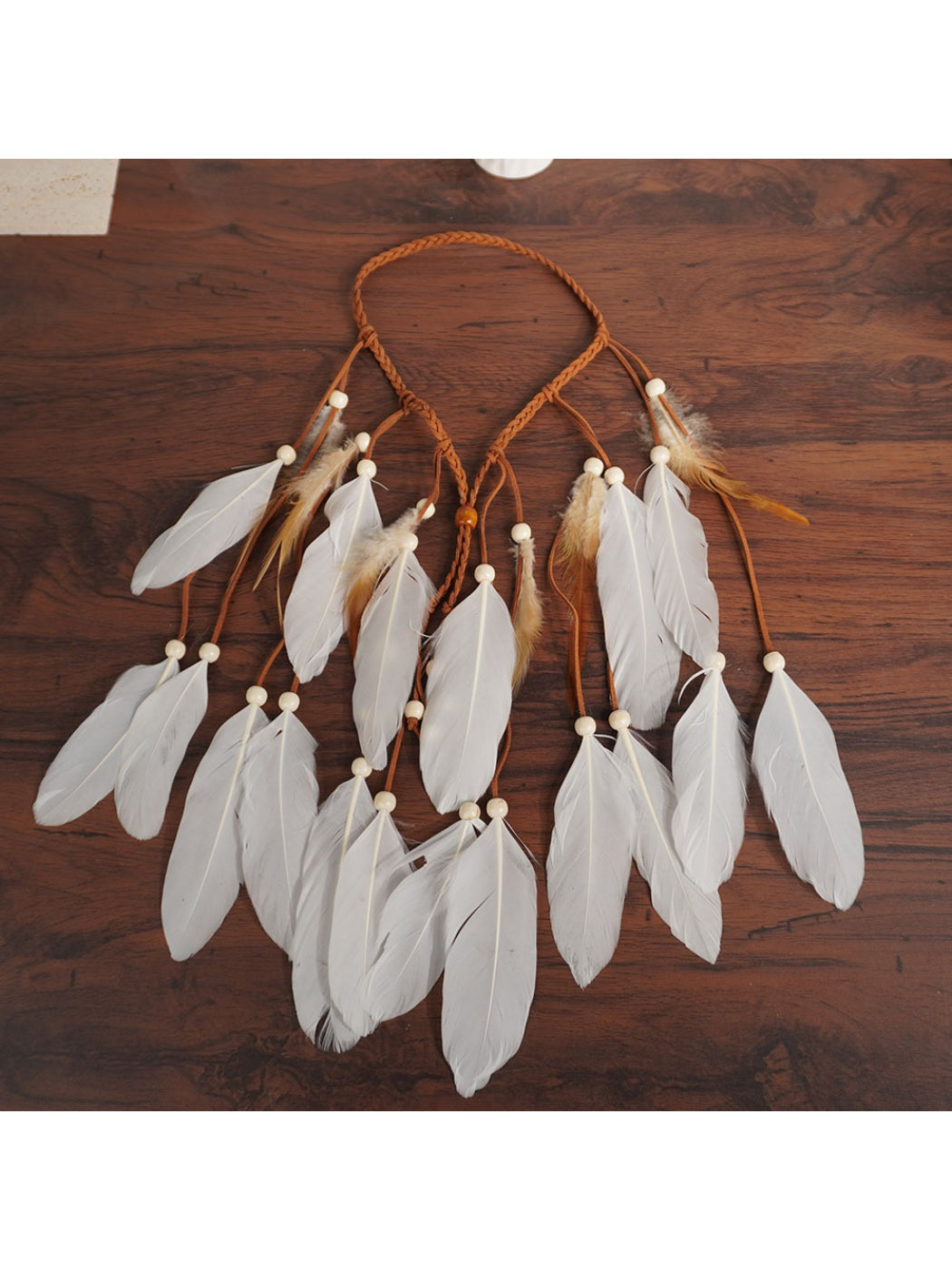 Close-up of Hairish Boho multi drop feather hair headpiece showing feather details