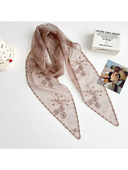 Scarvii floral mesh skinny scarf draped over a chair showing full length and floral print