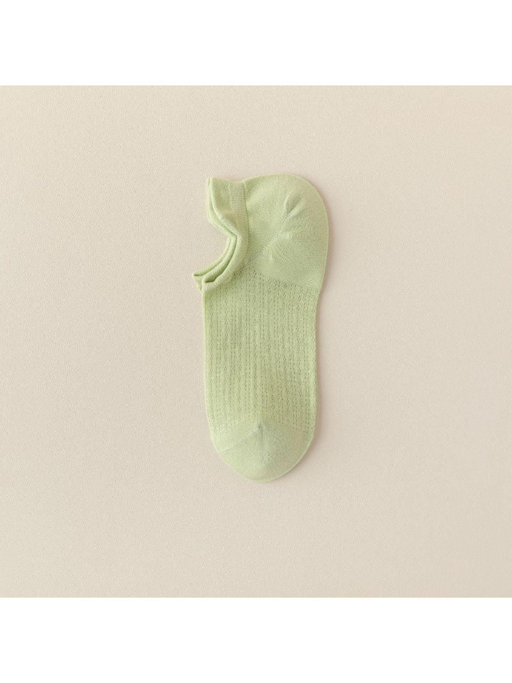 Black liner sock worn with black shoe, highlighting invisibility