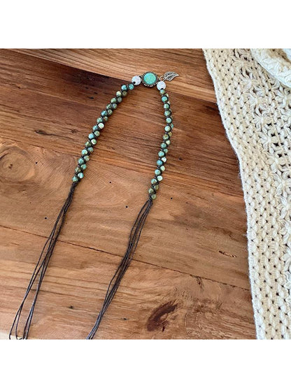 Beco Boho ring detail waist belt displayed on wooden surface with natural lighting