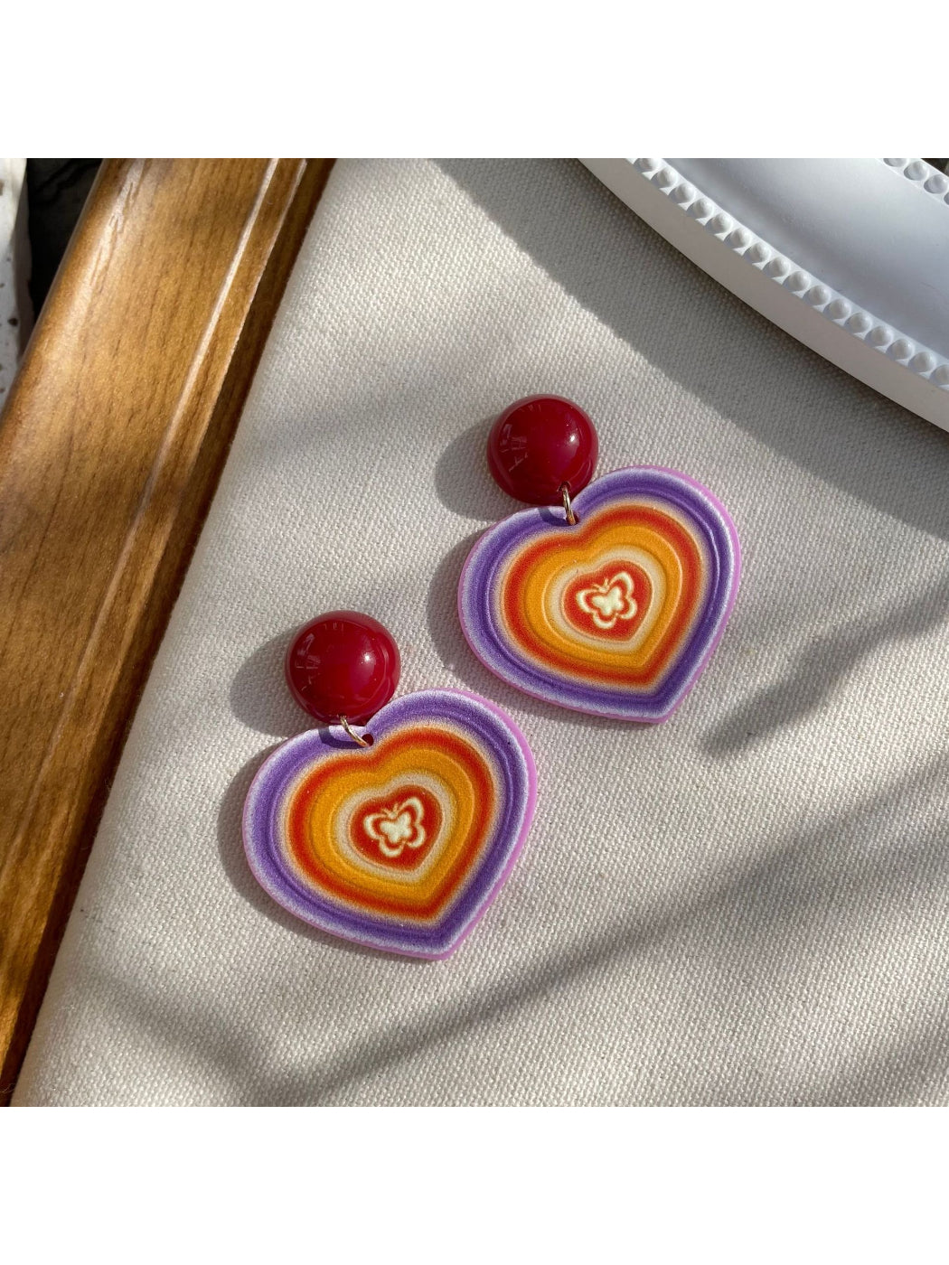 Earwish Rainbow Heart Drop Earrings displayed on a white background highlighting the drop design