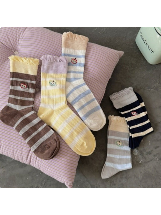 Rufia embroidered lace mesh mid-calf socks displayed flat on white background
