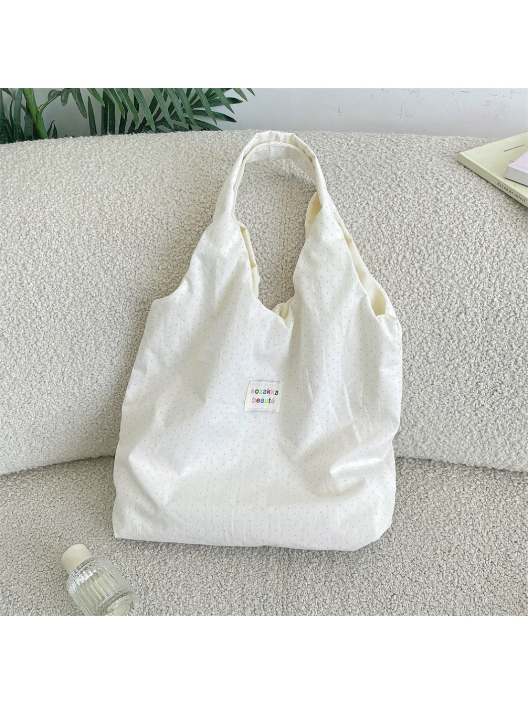Side view of Cosbai Casual Micro Dot Hobo Bag showing curved shape and single shoulder strap