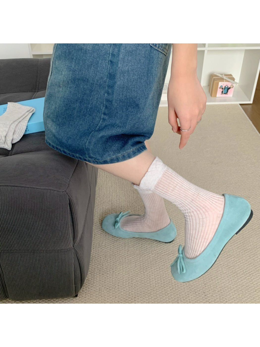 Pair of Rufia simple lace trim crew socks in white laid flat