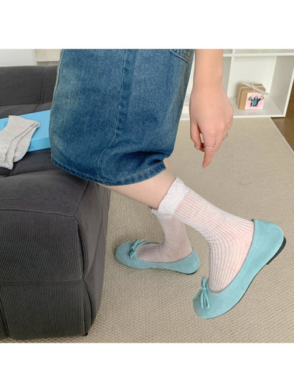 Pair of Rufia simple lace trim crew socks in white laid flat