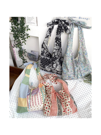Close-up of Cosbai tote bag showing tie strap and textured woven design