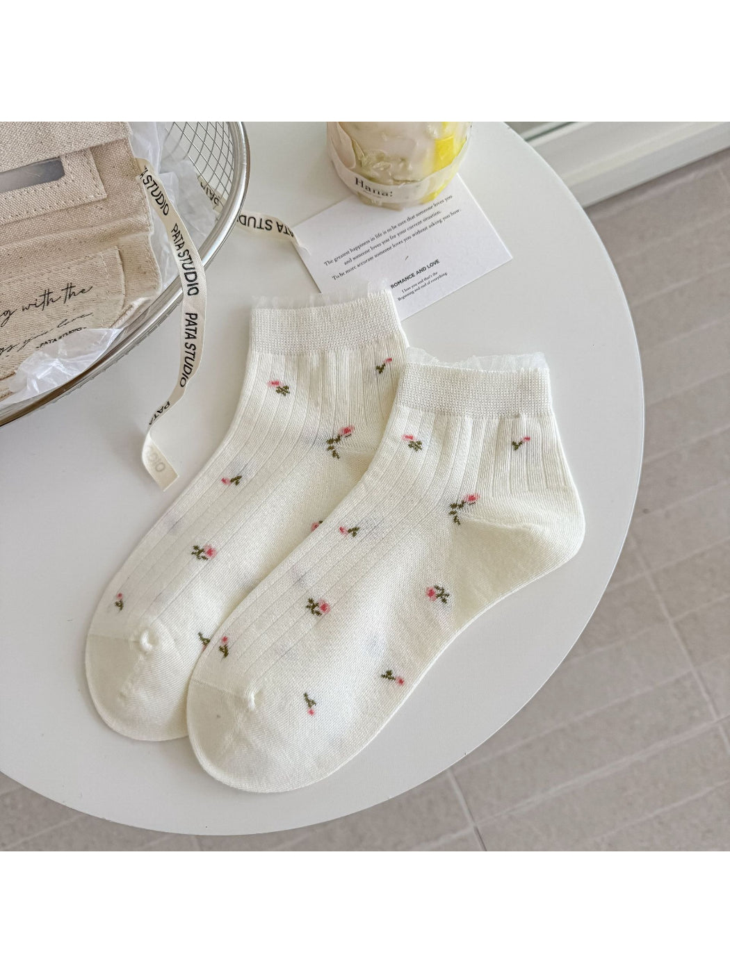 Rufia ankle socks folded to highlight floral lace trim and soft material