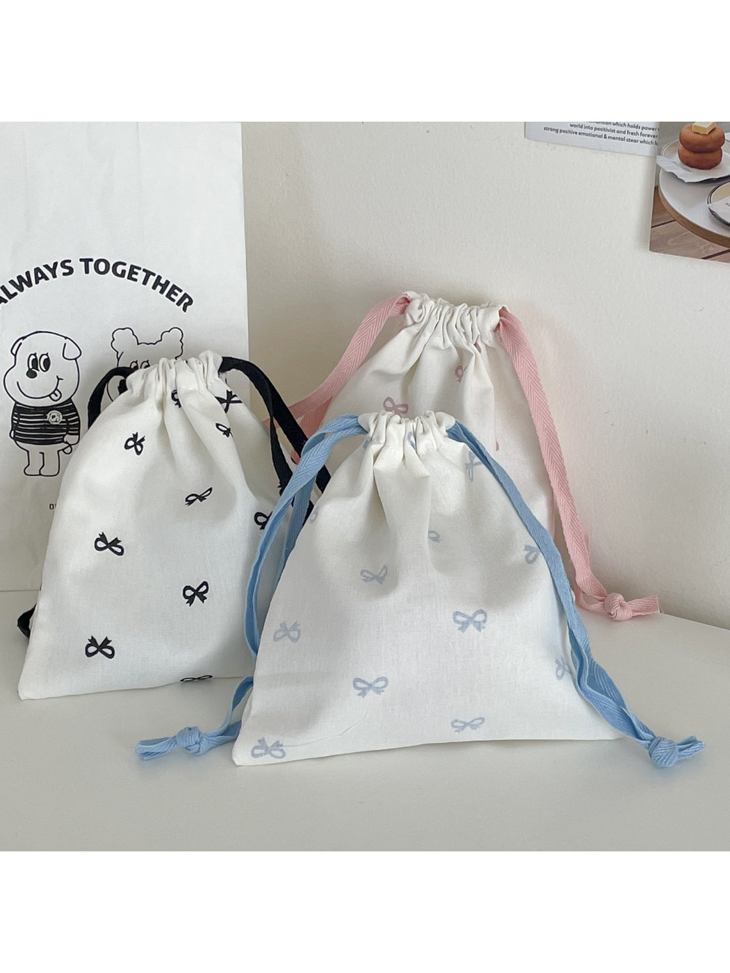 Cosbai bow pattern drawstring pouch with visible drawstring cords