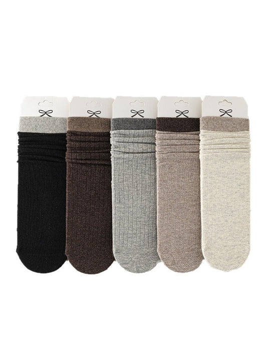 Pair of Rufia ribbed mid-calf socks for women in beige color displayed flat