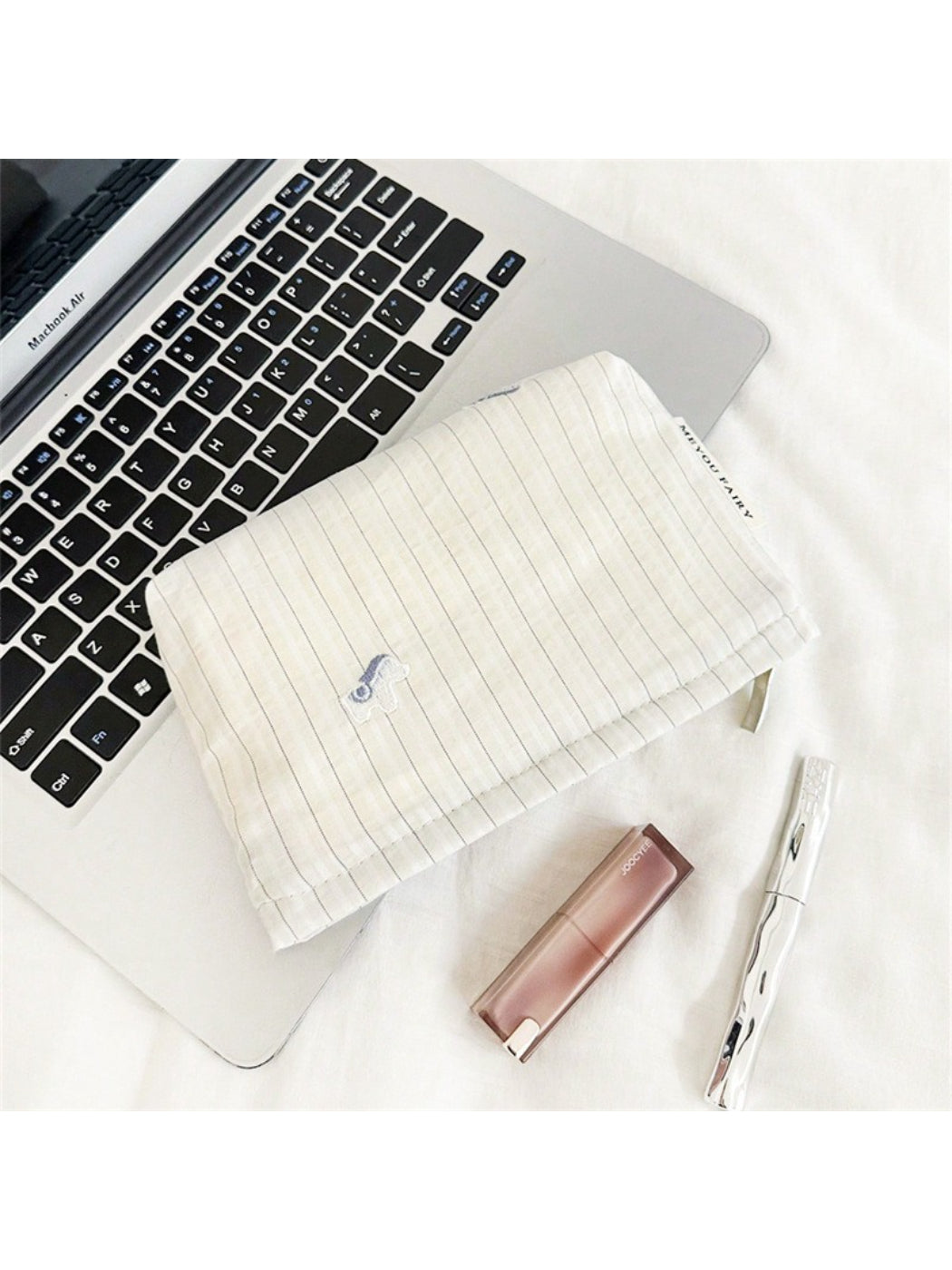 Cosbai Soft Stripe Makeup Pouch with makeup brushes inside