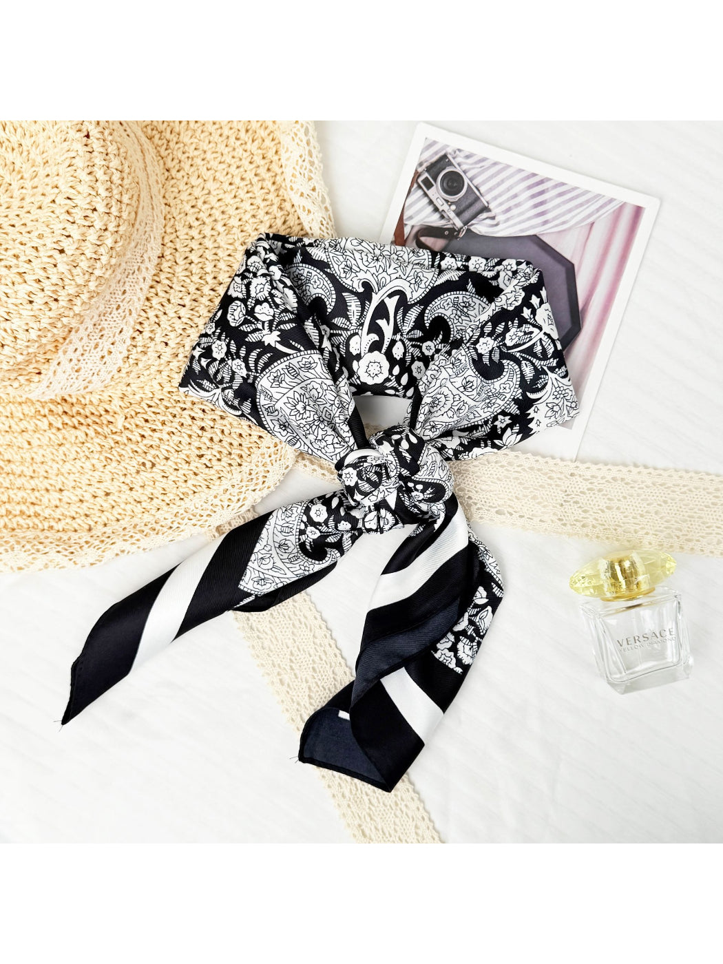 Scarvii paisley scarf folded neatly with visible edges and vibrant paisley print