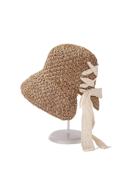 Close-up of Haila sun hat showing lace bow detail and woven texture