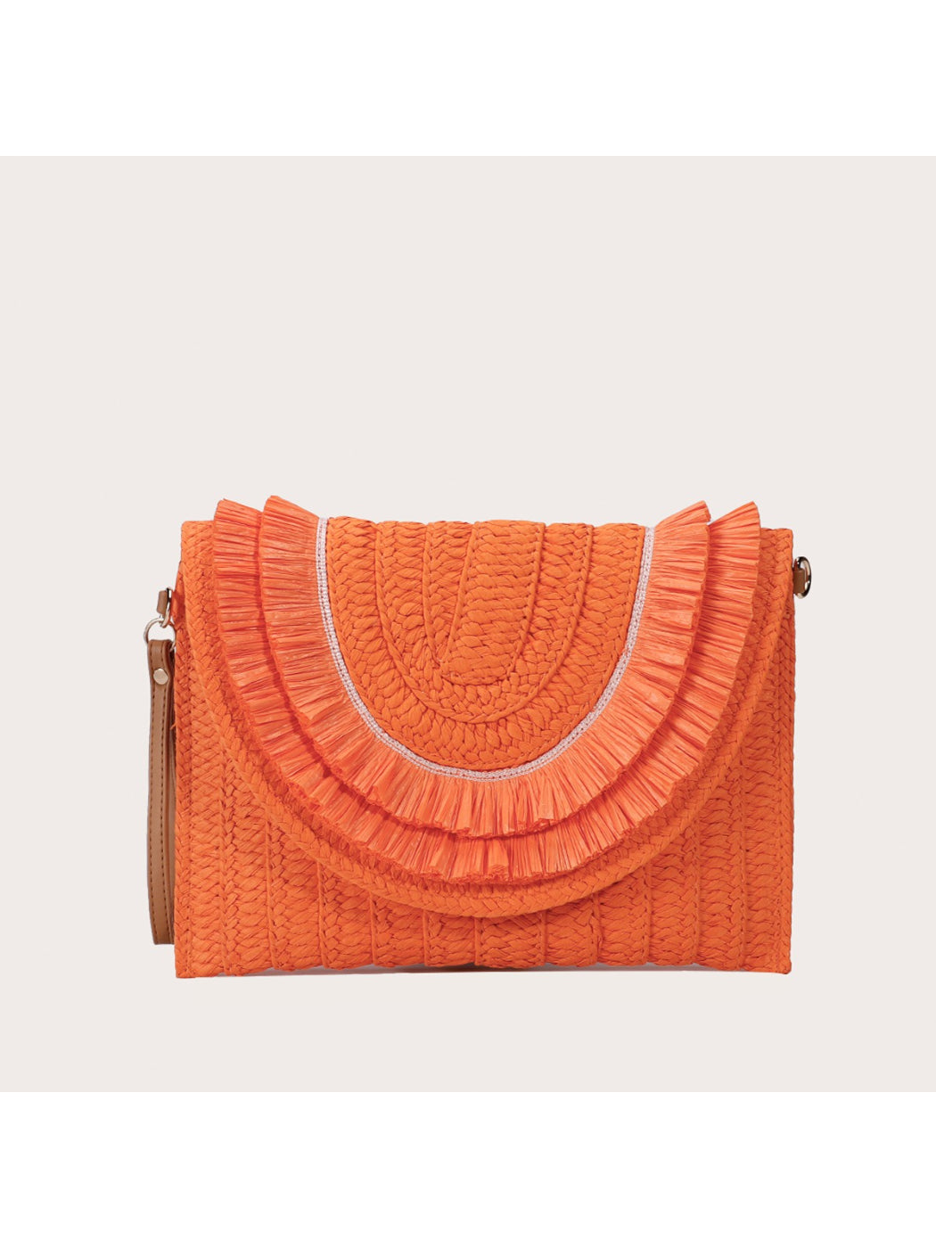 Cosbai woven tassel clutch bag held in hand to show size and scale