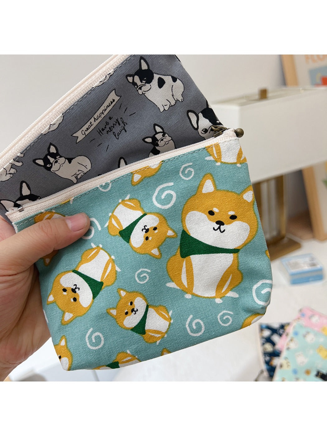 Cosbai coin purse showing a bright and cute cartoon face on front