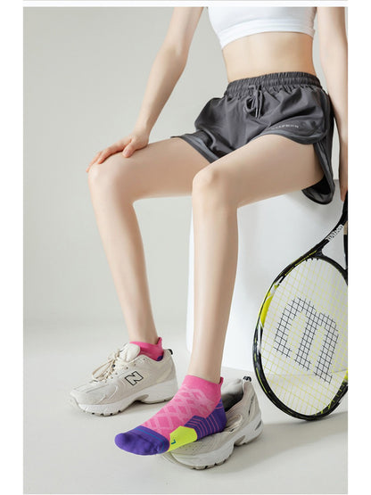 Pair of Rufia Colour Pop low cut sport socks in pastel colors on a white background