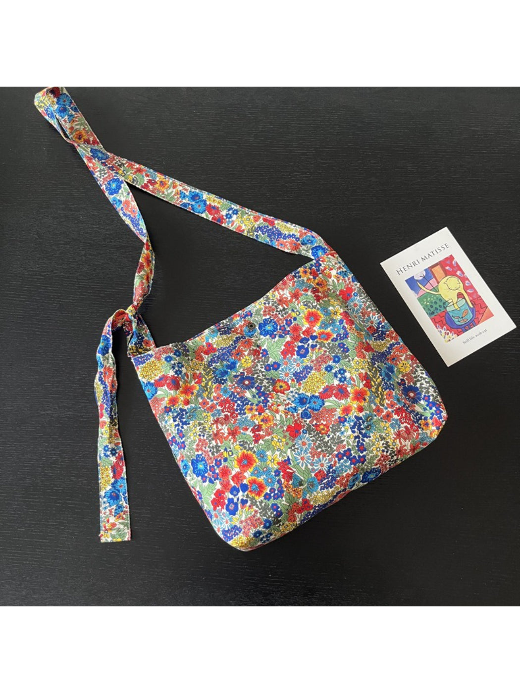 Side view of Cosbai Wildflower Print Shoulder Bag highlighting bag shape and strap attachment