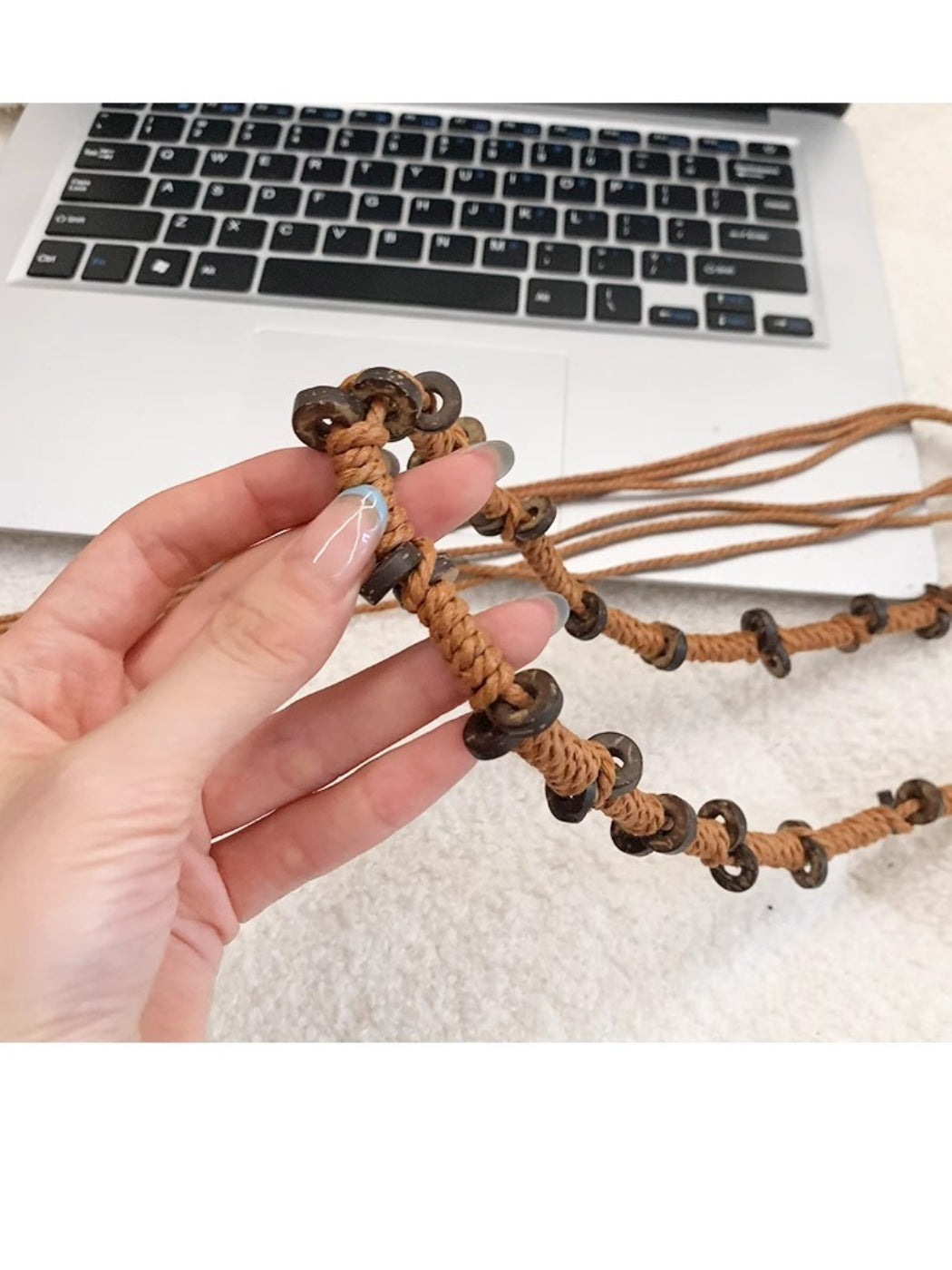 Side view of Beco knotted rope tie waist belt highlighting knot and rope ends