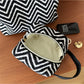 Cosbai Zigzag Print Zip Pouch partially open showing the pouch shape and zipper